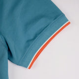 Polo homme bleu turquoise au col rayé contrasté BACK to LEGEND (zoom bord de manche)
