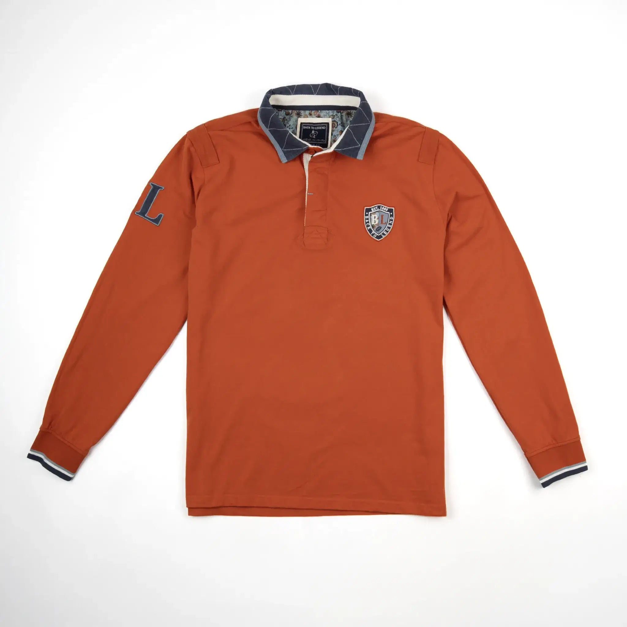Polo orange à manches longues toucher peau de pêche BACK TO LEGEND (vêtement à plat de face)