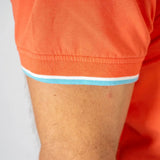 Polo homme orange col rayé et poche poitrine BACK to LEGEND (zoom bord de manche)